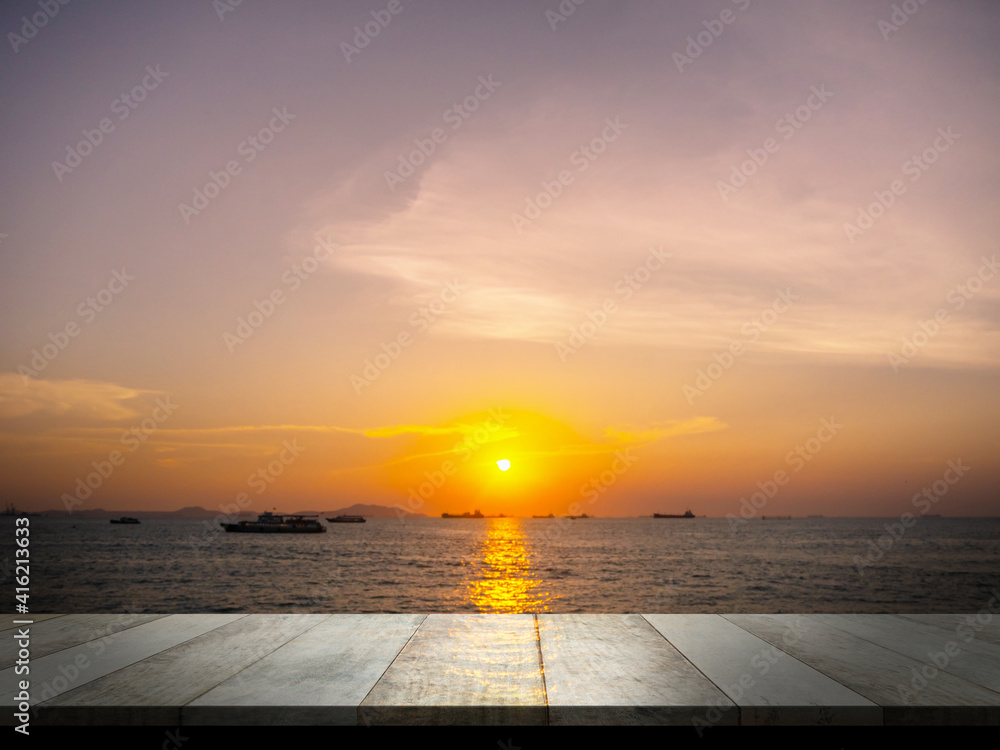 Wood perspective on sunset with sea. blank table for add text or products presentation.   beautiful blue ocean outdoor nature landscape  background. tourist summer travel holidays concept.