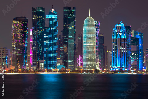 Doha skyline reflection at sea at night,Qatar