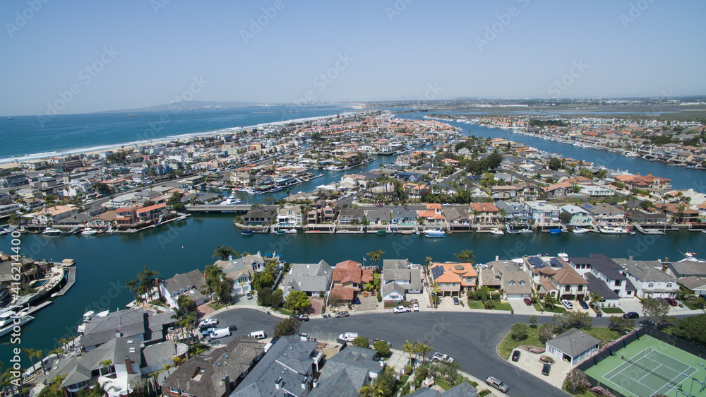Aerial view of a waterfront neighborhood next to the ocean
