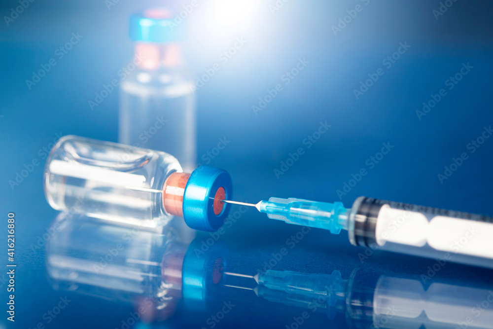 Covid-19 vaccination with vaccine bottle and syringe injection tool for coronavirus immunization treatment. Covid-19 vaccination with vaccine bottle and syringe injection tool for coronavirus immunization treatment.