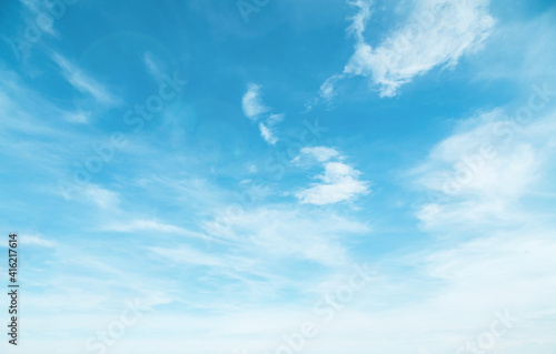 Summer Blue Sky and white cloud white background. Beautiful clear cloudy in sunlight spring season. Panoramic vivid cyan cloudscape in nature environment. Outdoor horizon skyline with spring sunshine.
