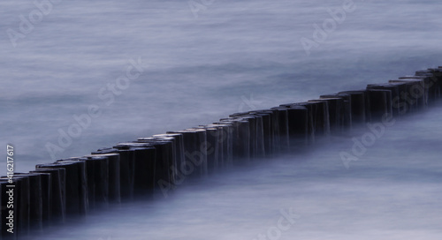 Groyne floated by waves at a beach 