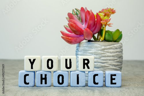 Soft cubes with the abbreviation YOUR CHOICE with a flower
