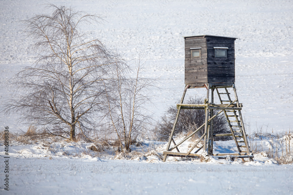 Winter european landscape with hunting tower covered with snow after heavy snowfall storm. Christmas concept. VYsocina, Czech Republic, Europe Winter european landscape with hunting tower covered with snow after heavy snowfall storm. Christmas concept. VYsocina, Czech Republic, Europe