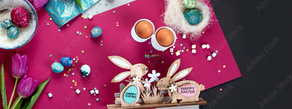 Painted Easter eggs with decorative wooden bunnies