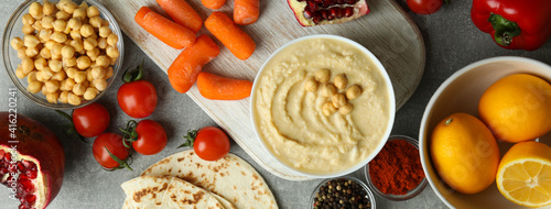 Concept of cooking hummus on gray background, top view