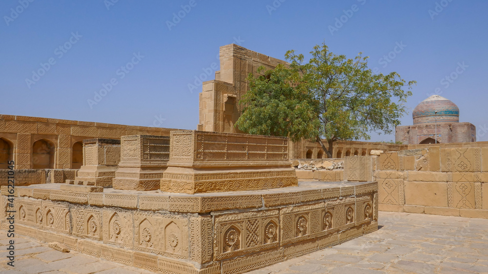Beautiful mughal era carved sandstone cenotaphs in courtyard of Isa Khan Tarkhan II tomb in UNESCO listed Makli necropolis, Thatta, Sindh, Pakistan