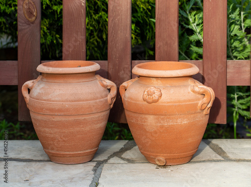 decorative clay pot in garden © wjarek