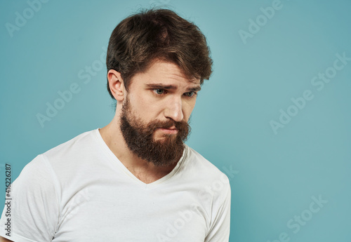 Portrait cropped view of male bushy beard brunette model