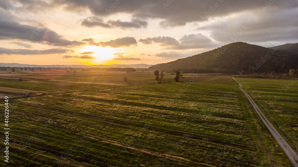 Obraz premium Aerial view of empty autumn fields at sunset.