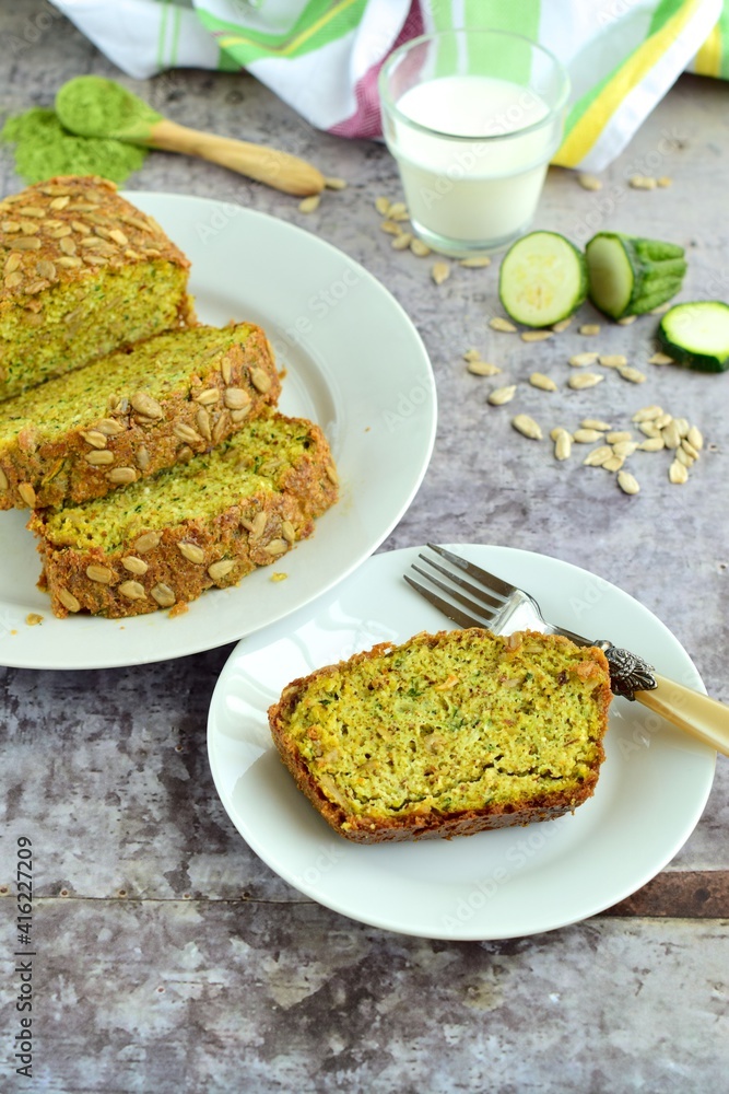 Wheatgrass zucchini bread with sunflower seeds. Served with milk Wheatgrass zucchini bread with sunflower seeds. Served with milk
