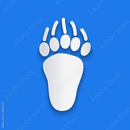 Paper cut Bear paw footprint icon isolated on blue background. Paper art style. Vector.