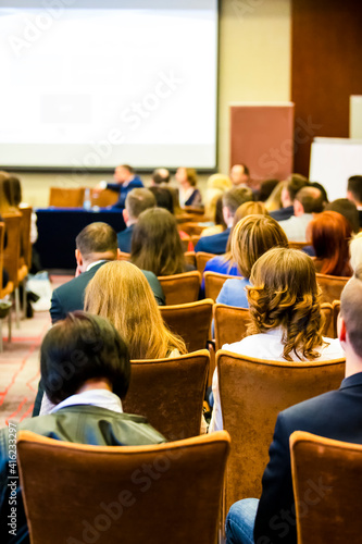 Business Discussion Table. Group of People At the Round Table Speaking In Front of the Group of People During a Congress.
