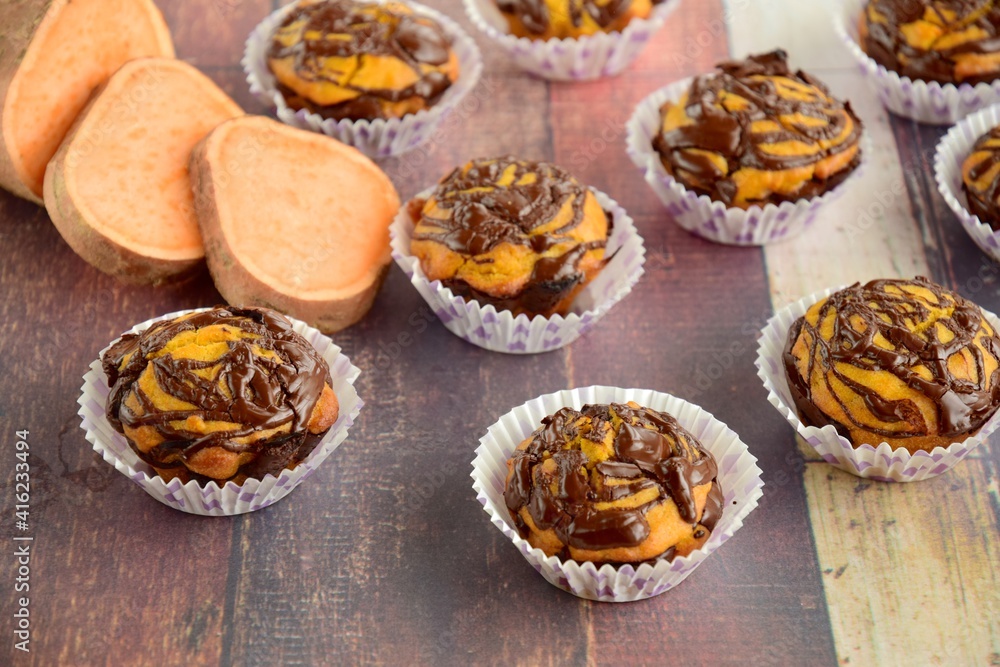 Sweet potato muffins with chocolate sauce topping