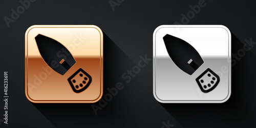 Gold and silver Human footprints shoes icon isolated on black background. Shoes sole. Long shadow style. Vector.