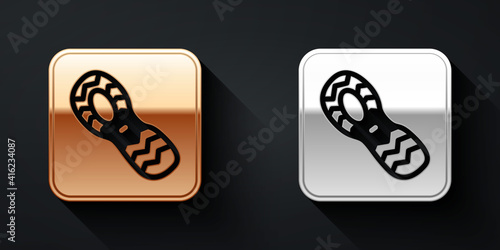 Gold and silver Human footprints shoes icon isolated on black background. Shoes sole. Long shadow style. Vector.