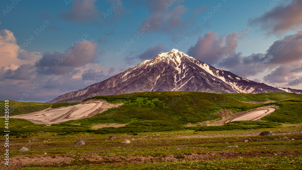 Fototapeta premium Panoramic view of the city Petropavlovsk-Kamchatsky and volcanoes: Koryaksky Volcano, Avacha Volcano, Kozelsky Volcano. Russian Far East, Kamchatka Peninsula.