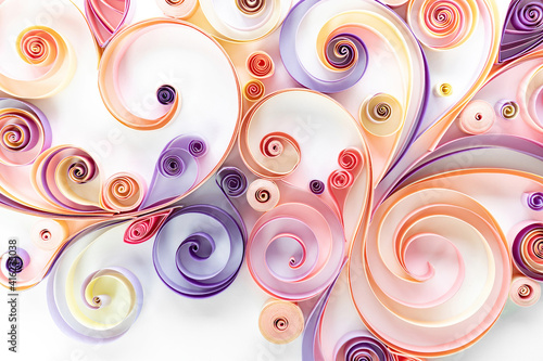 Floral curls and rolls from colored strips of paper. Quilling paper is an art hobby. Abstract background from paper filigree strips. Floral pattern from quilling paper stripes.