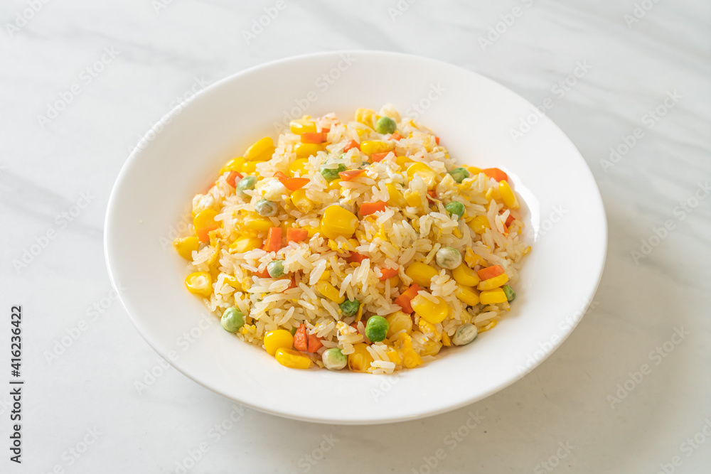 fried rice with mixed vegetable (carrot, green bean peas, corn) and egg fried rice with mixed vegetable (carrot, green bean peas, corn) and egg