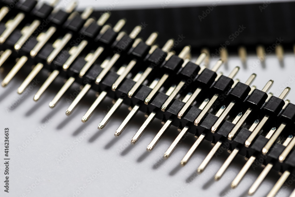 Macro Shot of Straight PCB Connectors Placed Bulk Against White Background. Macro Shot of Straight PCB Connectors Placed Bulk Against White Background.