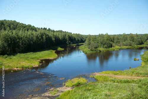 View of the forest and river in summer in the North Russia.