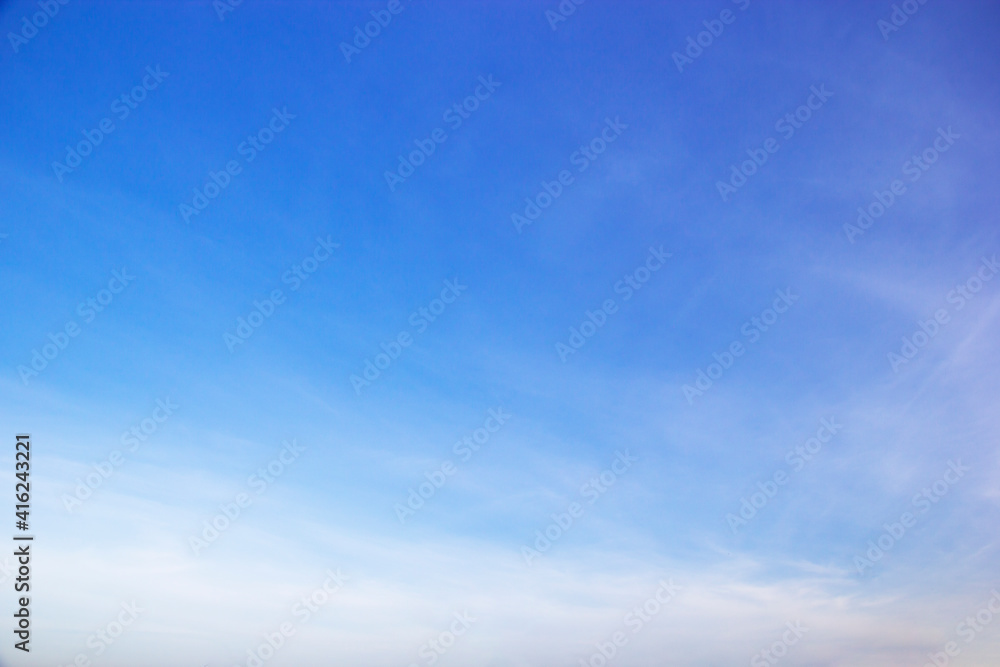 Blue sky background and white clouds soft focus, and copy space horizontal