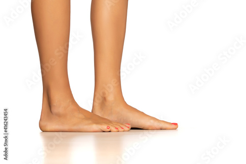 Female naked legs, isolated on white, side view. © Jasmina
