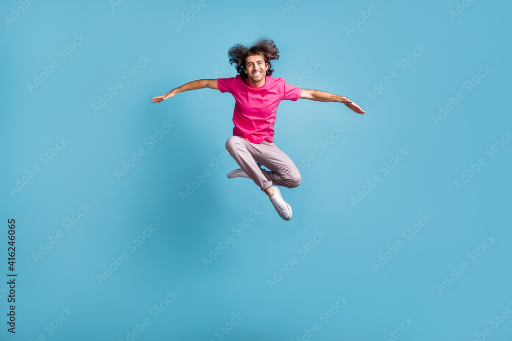 Full length body size view of nice cheerful sporty graceful guy jumping dancing contemporary isolated over bright blue color background