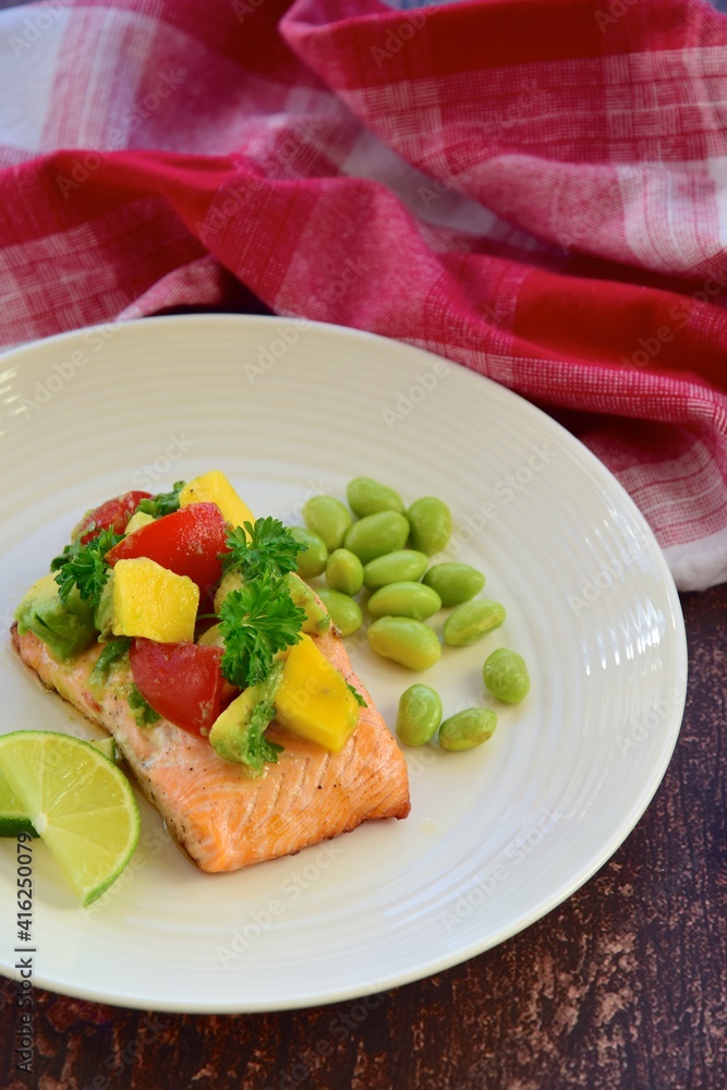 Grilled salmon with mango avocado tomato salsa and edamame beans Grilled salmon with mango avocado tomato salsa and edamame beans