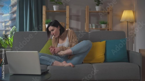 young woman feels an unpleasant smell on her feet