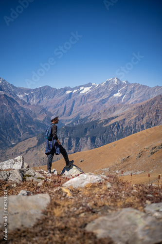 Hiker on the top of mountain in Manali Himachal Pradesh photo