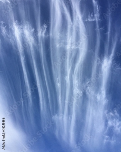 Blue sky with unusual clouds © Oksana