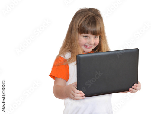 Portrait happy caucasian child isolated on white background. Little girl using laptop