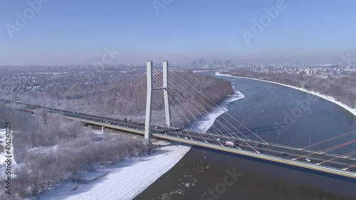 Panorama of the city of Warsaw with the Siekierkowski Bridge in the foreground. A winter day.