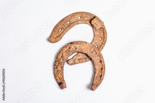 Cast iron metal horseshoes isolated on white background