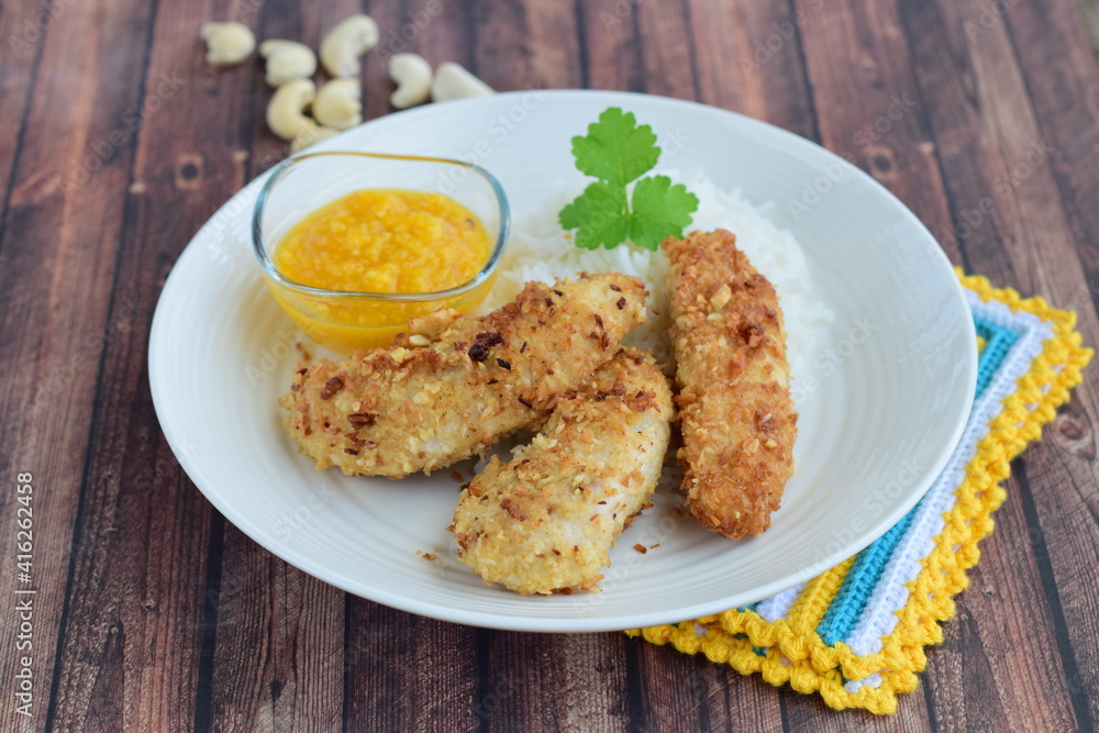 Chicken fingers breaded with cashew nuts and coconut flakes. Served with mango dip and steamed rice