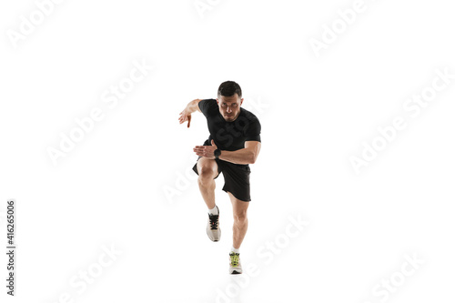 Starting. Caucasian professional sportsman training isolated on white studio background. Muscular, sportive man practicing. Copyspace. Concept of action, motion, youth, healthy lifestyle.