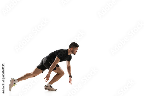 Squats. Caucasian professional sportsman training isolated on white studio background. Muscular, sportive man practicing. Copyspace. Concept of action, motion, youth, healthy lifestyle.