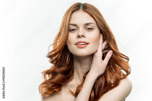 woman with flowing hair closed eyes smile femininity bare shoulders