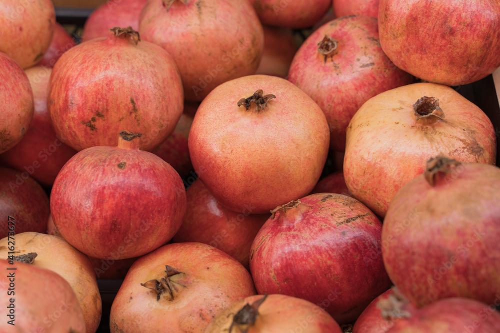 Group of pomegranates. Pomegranate close up, background Group of pomegranates. Pomegranate close up, background