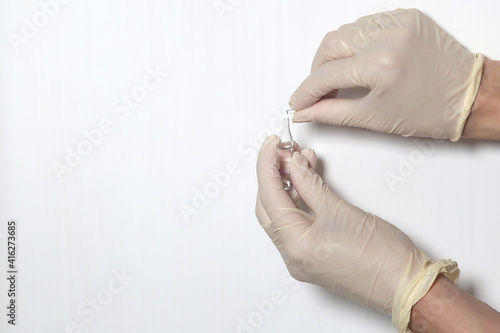 Doctor filling syringe with medication  closeup. Vaccination and immunization