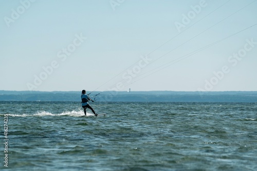Photography People swim in the sea on a kiteboard or kitesurfing
