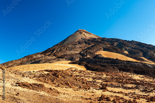 Silhouette of volcano del Teide against blue sky. Pico del Teide mountain in El Teide National park. Tenerife, Canary Islands, Spain