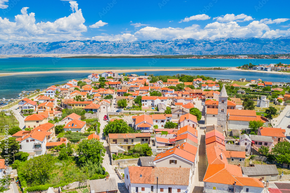 Old town on Nin on Adriatic coast in Croatia, seascape and Velebit mountain in background, panoramic view