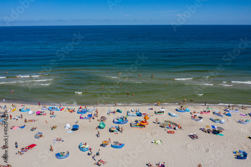 Sunbathing on the beach by the sea. Aerial drone view of  Baltic Sea coast in Hel peninsula, Jastarnia. Puck Bay in Poland © Chawran