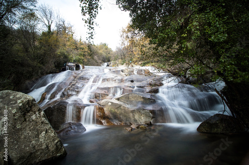 waterfalls of a mountain river in autumn focus selected
