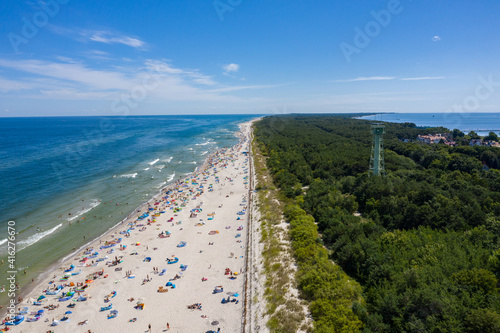 Sunbathing on the beach by the sea. Aerial drone view of  Baltic Sea coast in Hel peninsula, Jastarnia. Puck Bay in Poland © Chawran