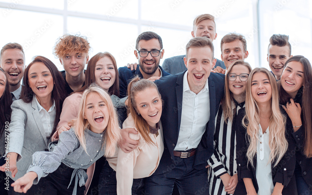 team of cheerful young people looking at the camera team of cheerful young people looking at the camera