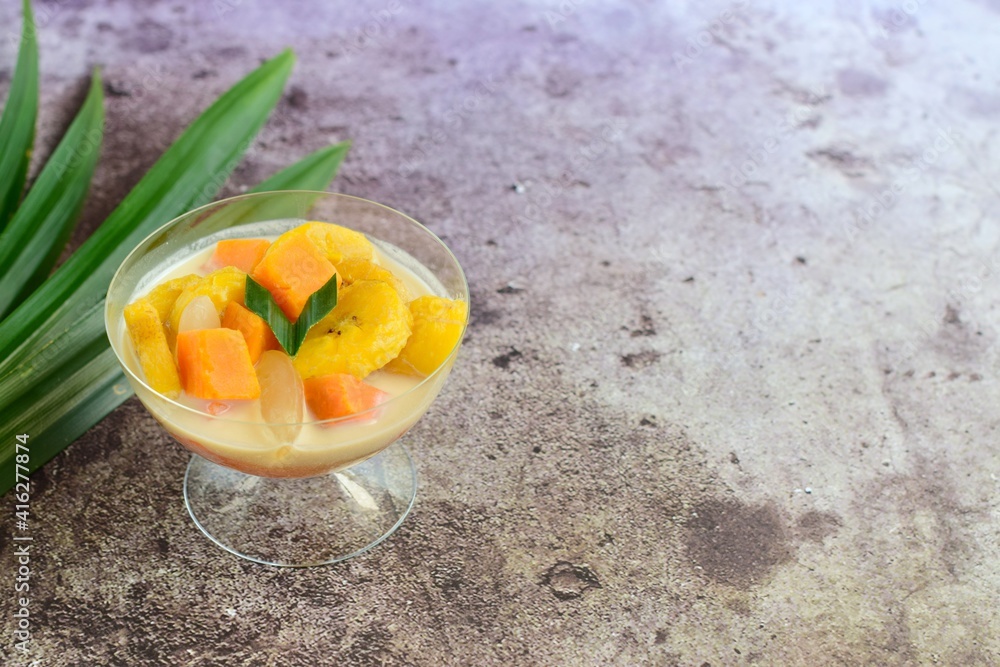 Indonesian Food - Kolak Pisang Ubi Kolang Kaling (Banana, sweet potato and palm seed). Cooked with coconut milk, palm sugar and pandanus leaves. Indonesian Food - Kolak Pisang Ubi Kolang Kaling (Banana, sweet potato and palm seed). Cooked with coconut milk, palm sugar and pandanus leaves.