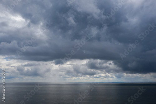 Aerial drone view of Baltic Sea coast in Hel peninsula, Jastarnia. Drak clouds by the Puck Bay in Poland.